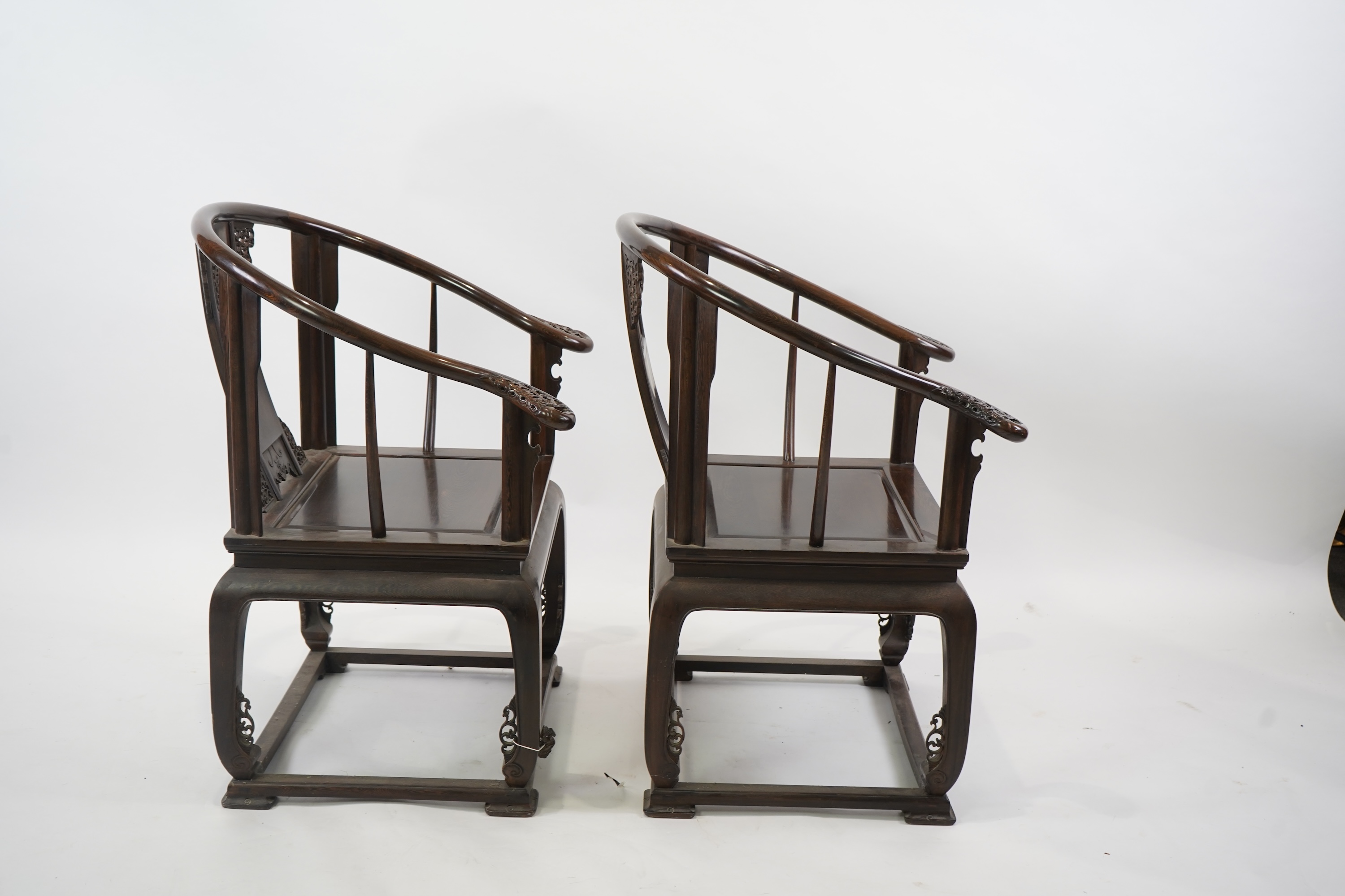 A pair of Chinese jichimu horseshoe shaped armchairs and a matching table, 19th/20th century